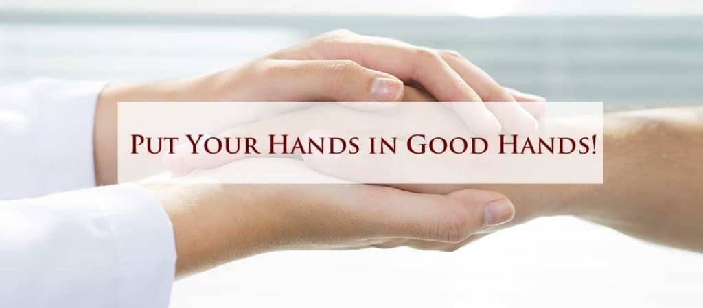 A hand therapist holding the hands of a patient with the words put your hands in good hands