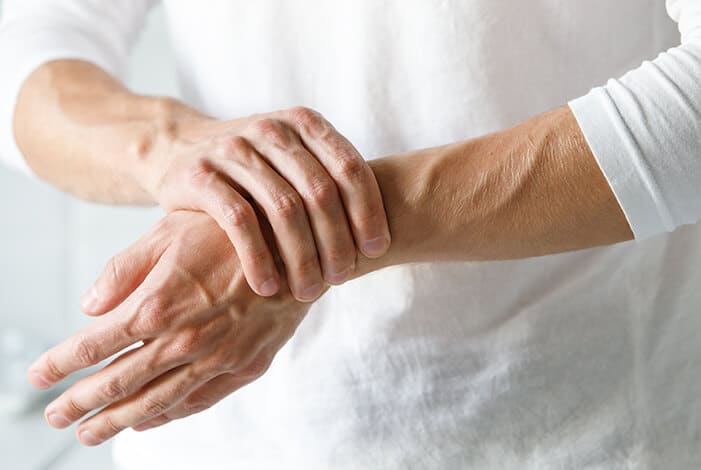 an elderly person with wrist pain